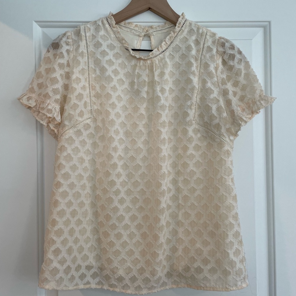 Cutest detailed top in blush cream!